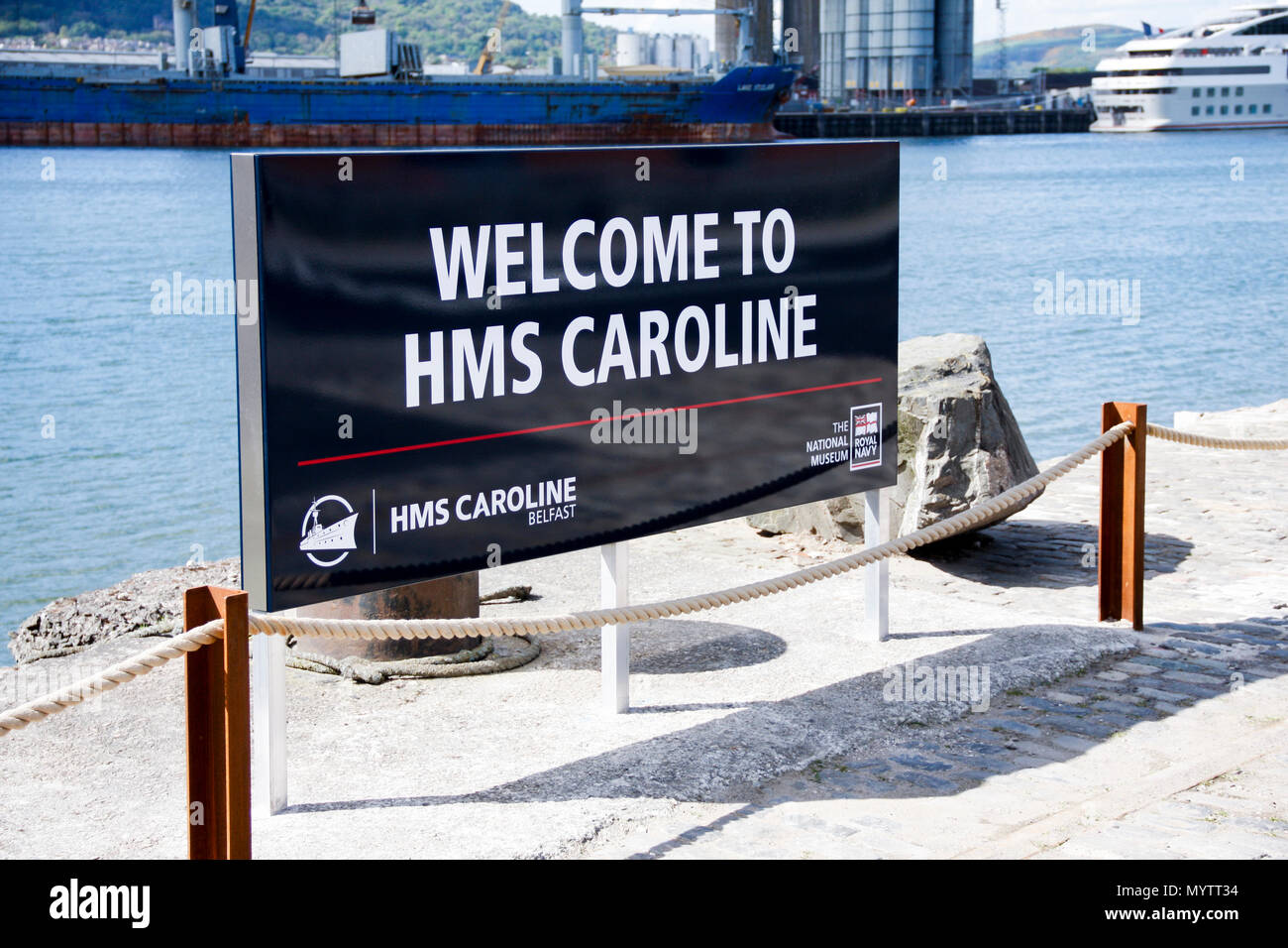 Welcome sign for HMS Caroline, a restored World War 1 battleship moored in Titanic Quarter, Belfast and the last survivor of the Battle of Jutland Stock Photo