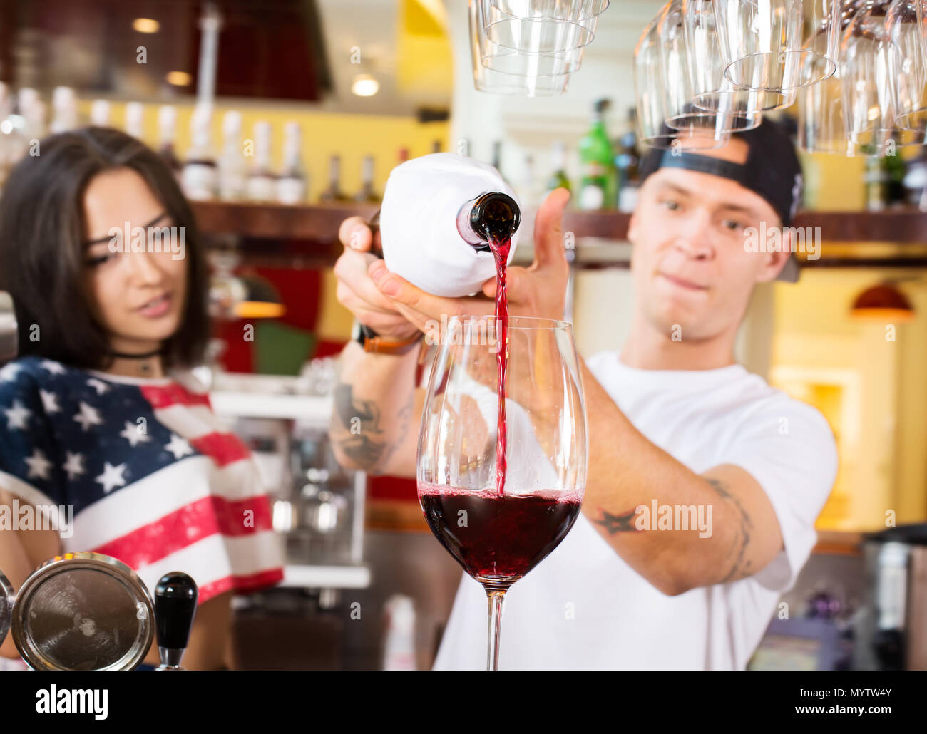 Female and male bartenders at work Stock Photo Alamy