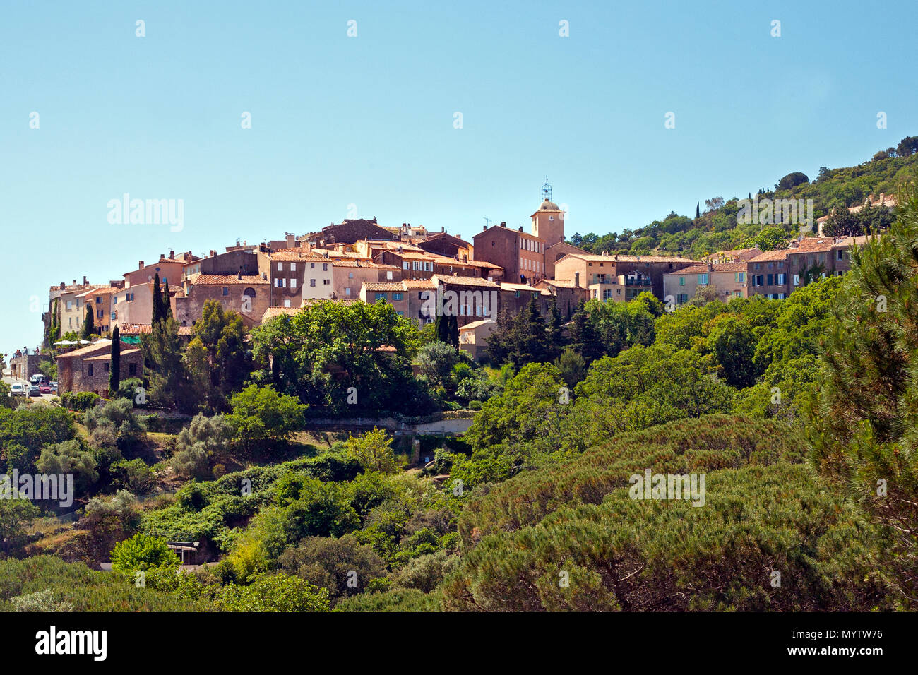 May 15, 2016: Ramatuelle, France- view of the french village of Ramatuelle surrounded by green trees on a sunny day Stock Photo