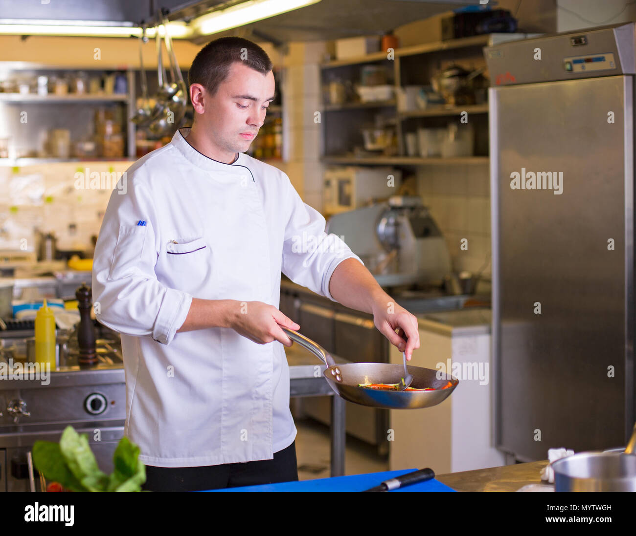 The Chef prepares food Stock Photo - Alamy