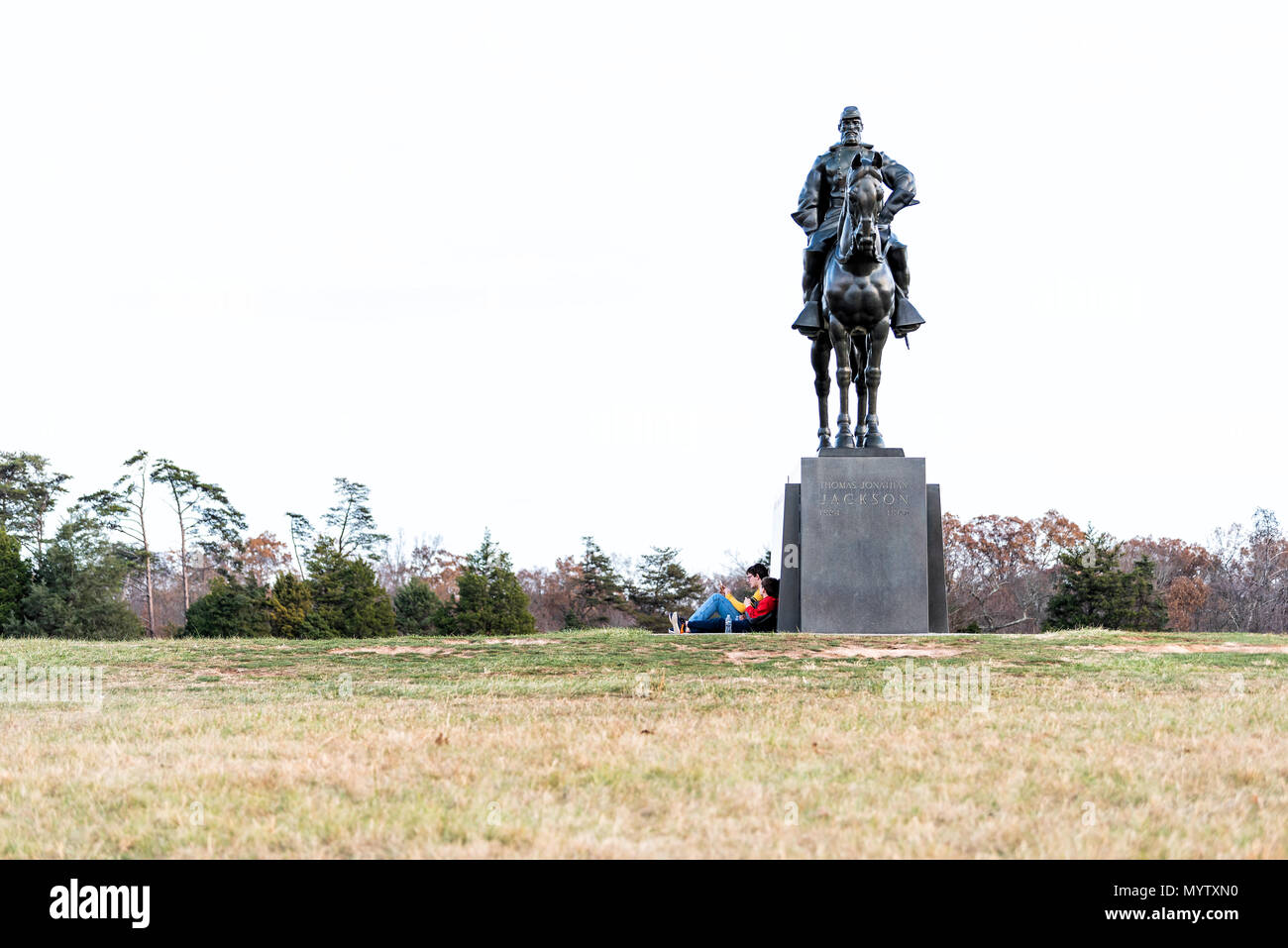 Manassas, USA - November 25, 2017: Statue of Stonewall Jackson and many tourists people sitting in National Battlefield Park in Virginia where Bull Ru Stock Photo