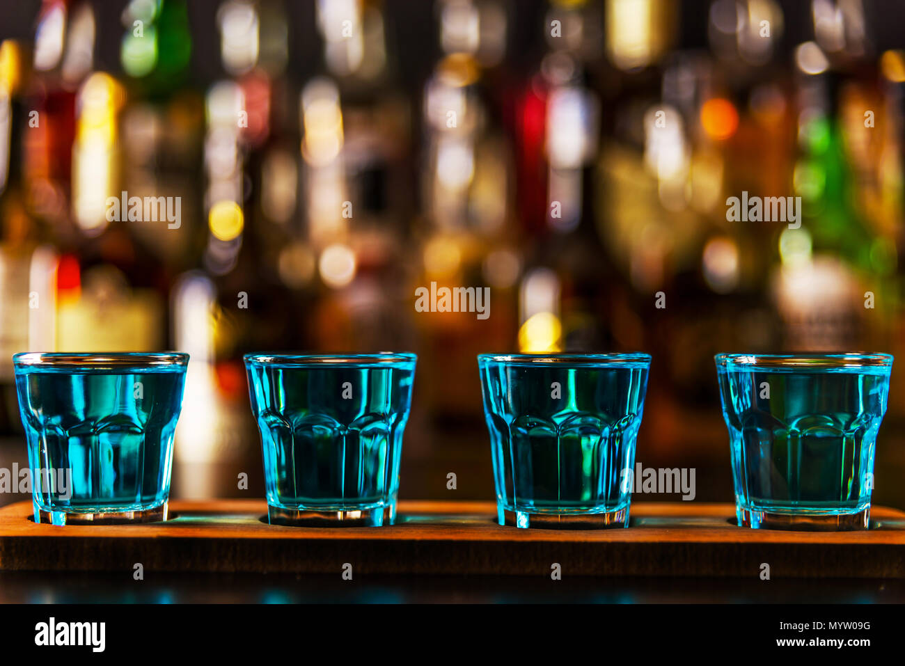Popular blue drink shot kamikaze on the background of the bar with ...