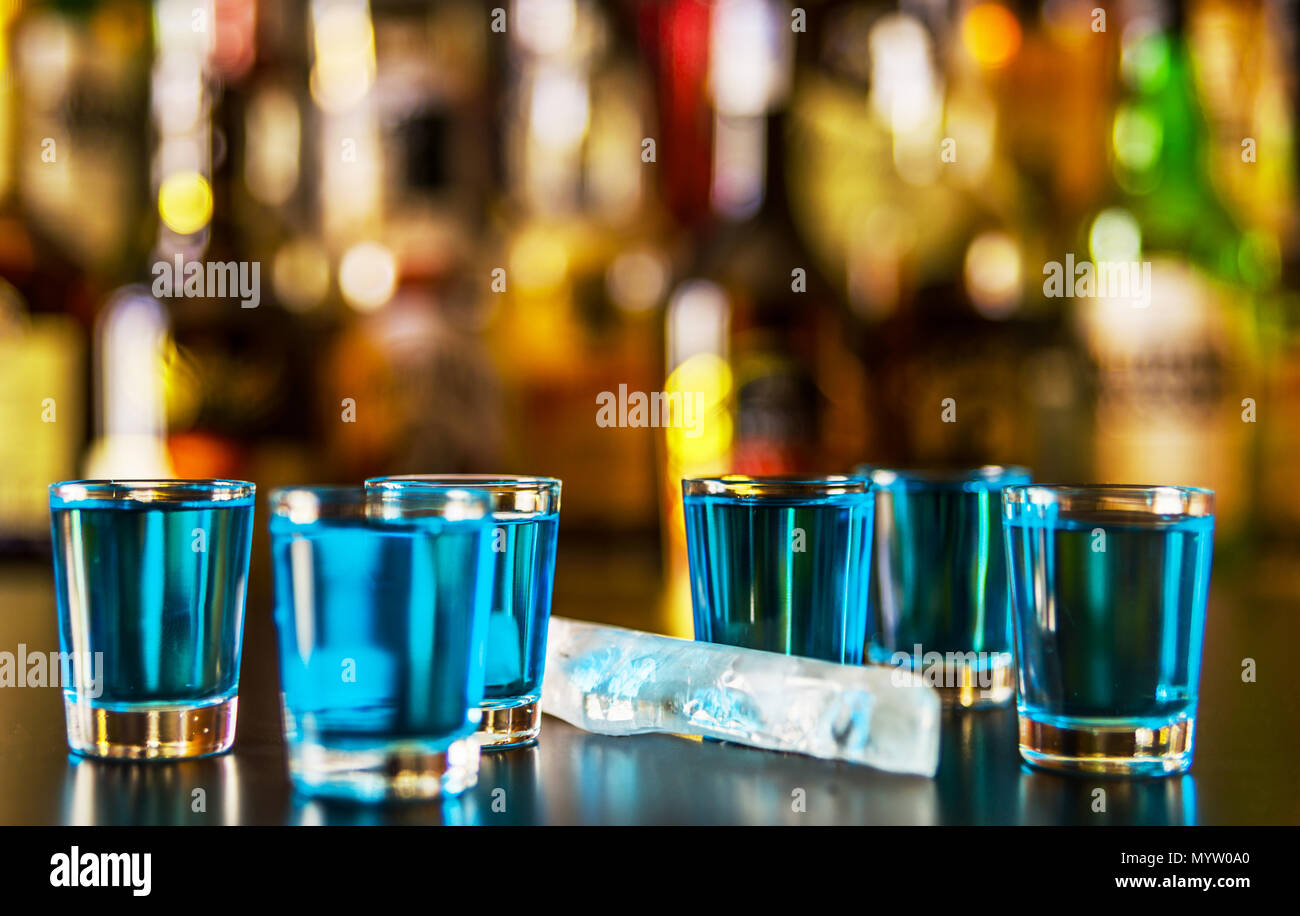 Popular blue drink shot kamikaze on the background of the bar with ...