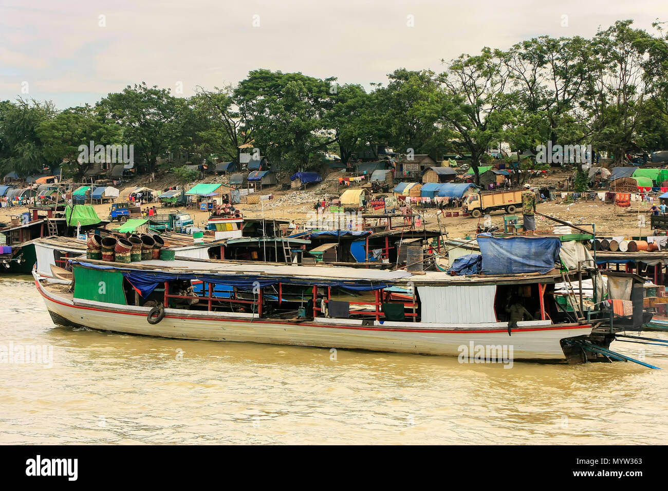 Boats anchored at Ayeyarwady river port in Mandalay, Myanmar. Ayeyarwady river is the largest