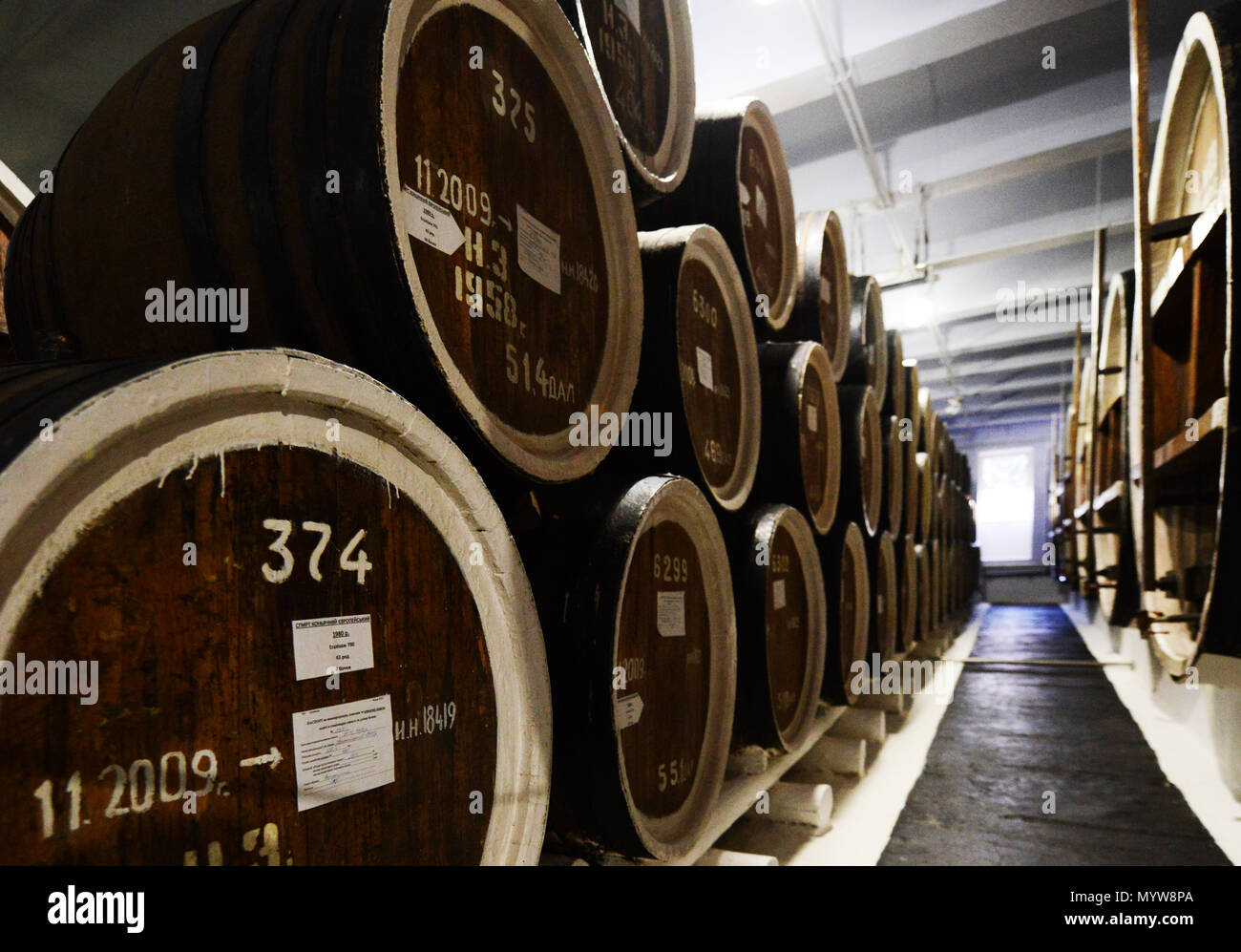 Cognac aging in oak barrels in the Shustov winery in Odessa Stock Photo