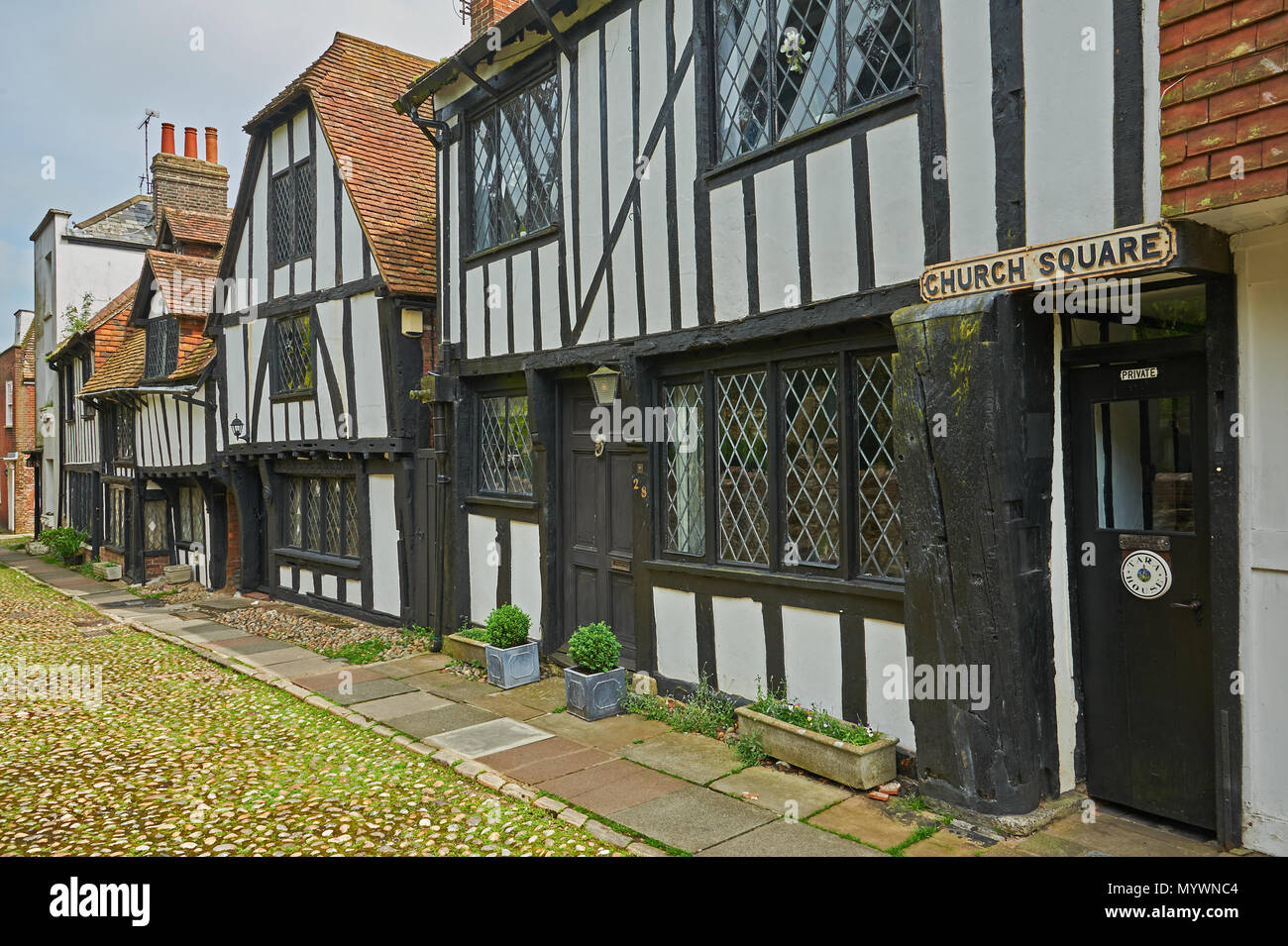 A mix of building style line the cobbled streets in the centre of Rye, Easr Sussex Stock Photo