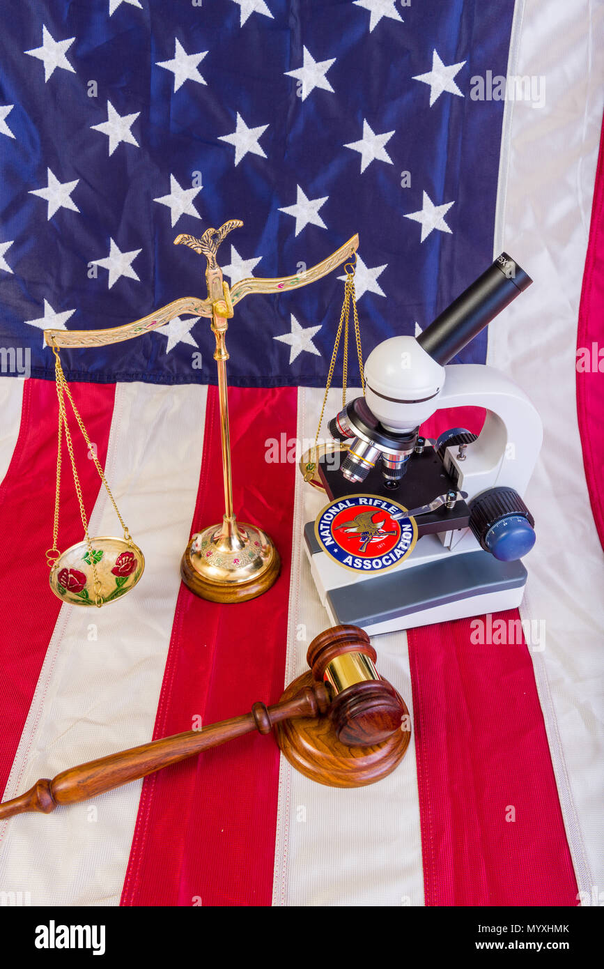 Winneconne - 11 May 2018: The NRA under a microscope showing the scrutiny the second ammendment is under with the American flag Stock Photo