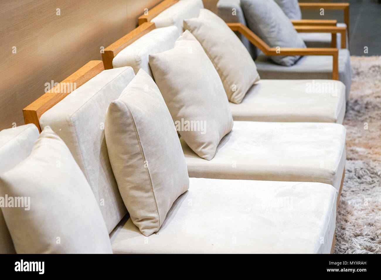 classic creamy and wooden sofa in Bangkok Tourist Lounge for welcome VIP  person with luxury capet Stock Photo - Alamy