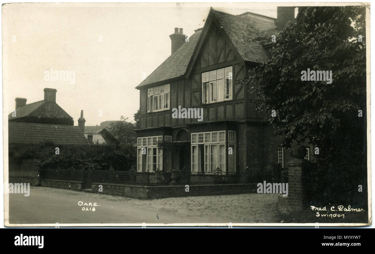 . Postcard of Oare, Wiltshire, England. The photographer was Fred C. Palmer of Tower Studio, Herne Bay, Kent ca.1905-1916, and of 6 Cromwell Street, Swindon ca.1920-1936. He is believed to have died 1936-1939. This print has darkened with age, but it would be inappropriate to adjust the brightness because detail would be lost. Border The remaining border of this image is important for researchers of this photographer. Some photographers trimmed their images more than others, and Palmer has a reputation for producing smaller postcards than other early 20th century UK photographers. He took his  Stock Photo