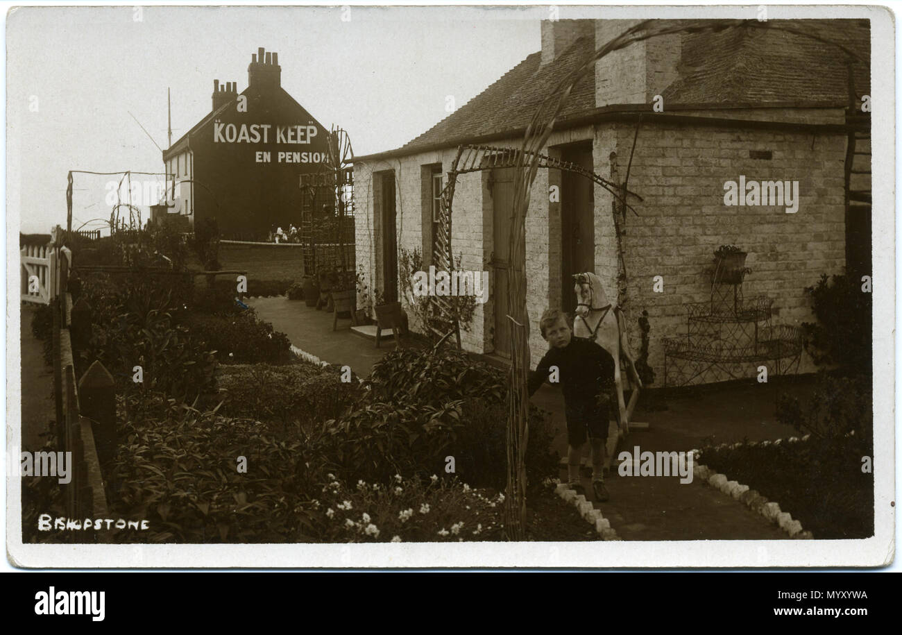 . Postcard of Bishopstone, Swindon, England. The card is unused and unpostmarked. The photographer was Fred C. Palmer of Tower Studio, Herne Bay, Kent ca.1905-1916, and of 6 Cromwell Street, Swindon ca.1920-1936. He is believed to have died 1936-1939. Points of interest  This site is unknown to lifelong residents of Bishopstone. However there is a reference here to the Collard family living at Koast Keep, Bishopstone, in 1931. Editing This unedited scan of an original print has darkened with age, but it would be inappropriate to adjust the brightness because detail would be lost. It is suggest Stock Photo