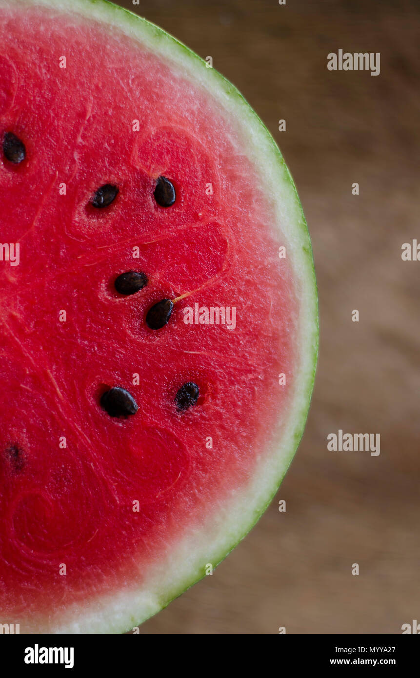 A refreshing slice of watermelon, offering juicy sweetness and vibrant color, perfect for summer gatherings and picnics. Stock Photo