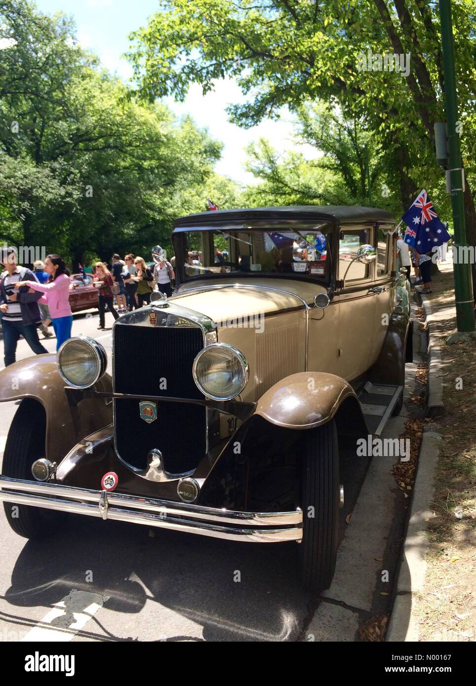 Vintage car with Australian flags at RACV Federation Vehicle Display, Kings Domain, St Kilda Rd