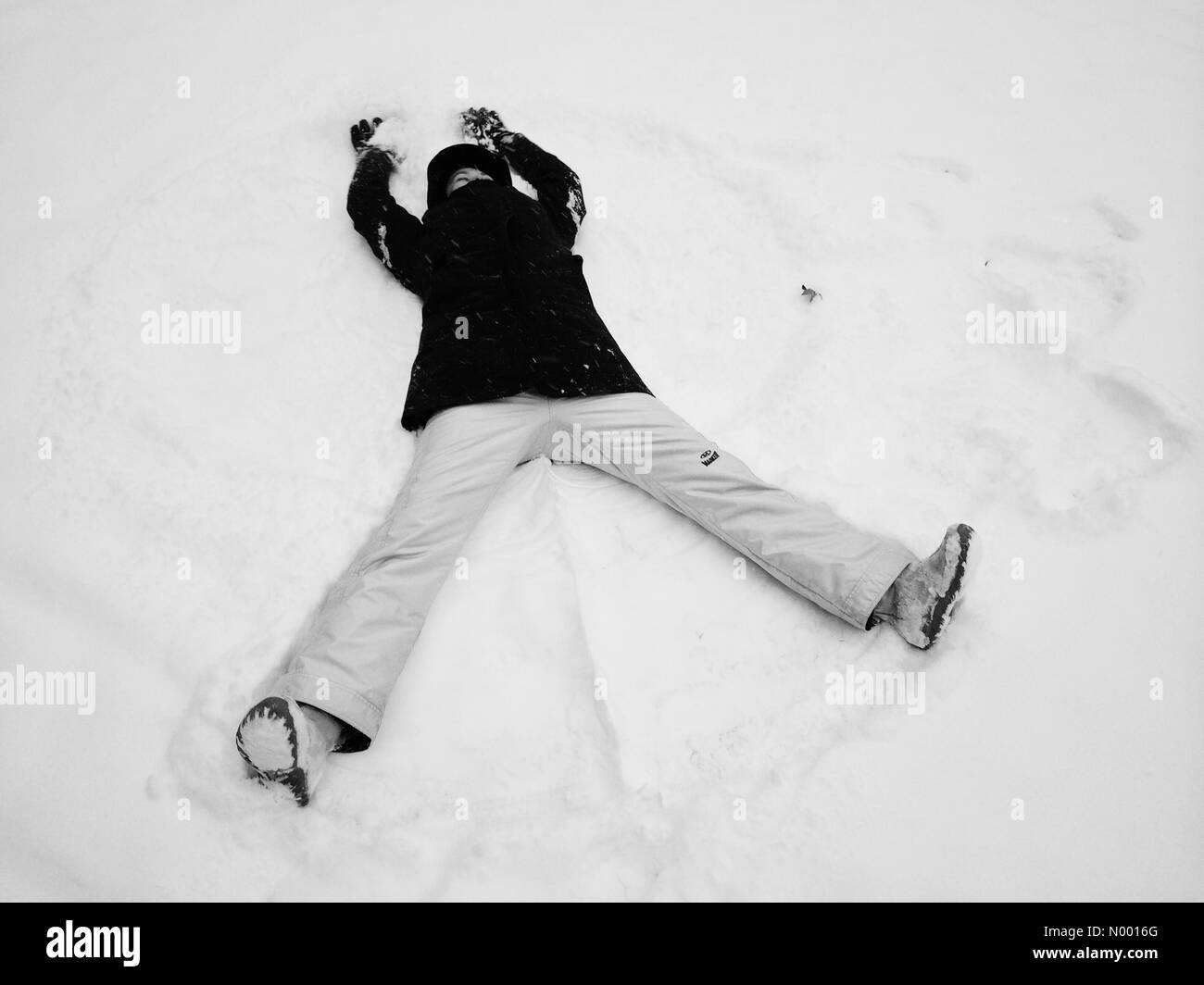 Having fun making snow angels during the snowstorm in New Jersey, USA. Stock Photo