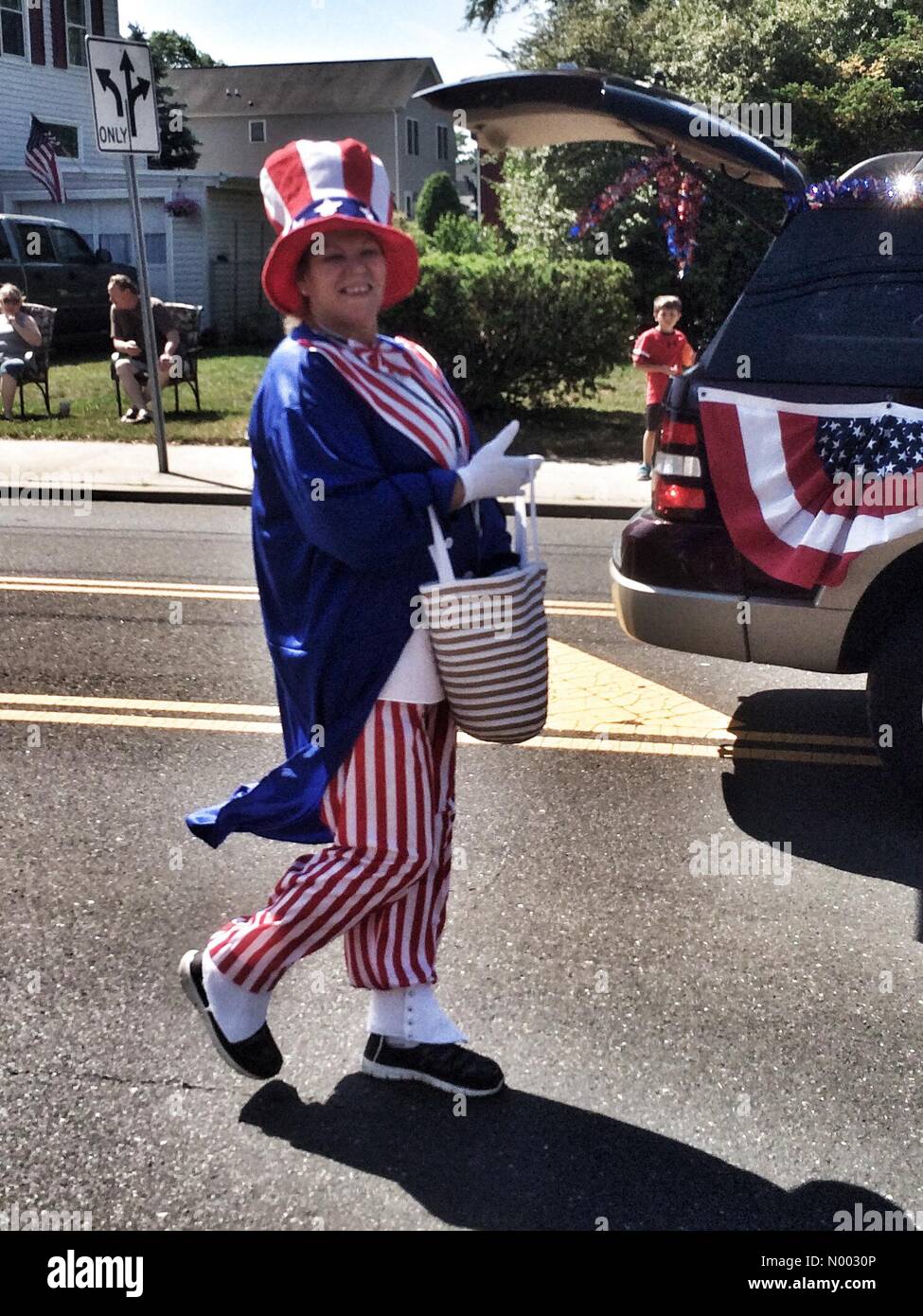 Sayreville, USA. 25th May, 2015. A female Uncle Sam marching in the