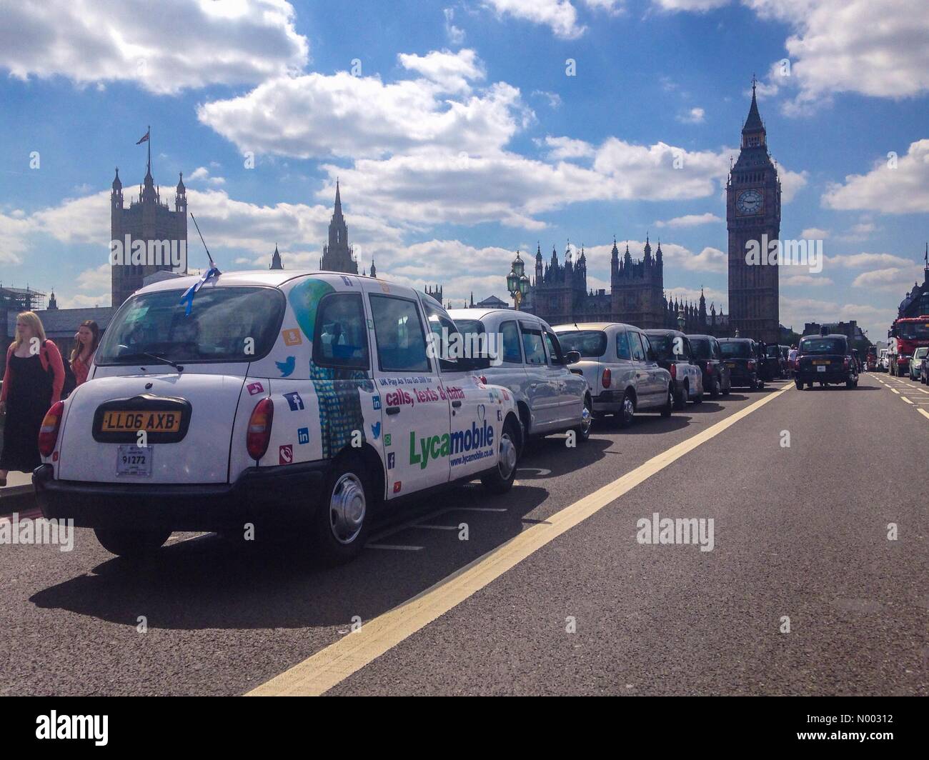 London, UK. 26th May, 2015. London black cab drivers protest against the taxi app uber on Westminster Bridge. Credit:  Paul Swinney/StockimoNews/Alamy Live News Stock Photo