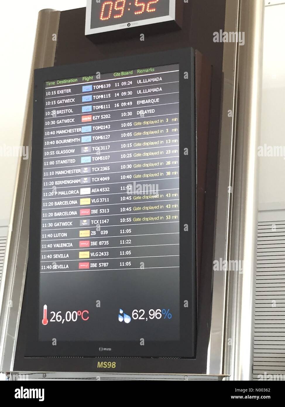 Mahón, Islas Baleares, Spain. 08th June, 2015. Monday 8th June - Menorca airport - departures board showing flight to London Gatwick as delayed due to impending strike action Credit:  DanFisher/StockimoNews/Alamy Live News Stock Photo