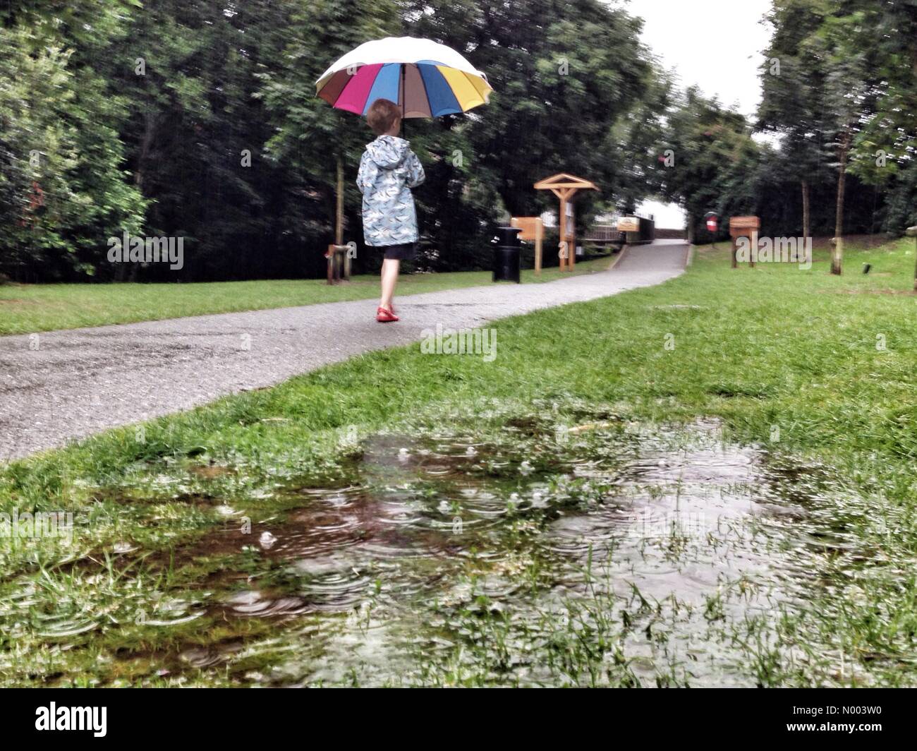child-walking-to-school-in-rain-hi-res-stock-photography-and-images-alamy