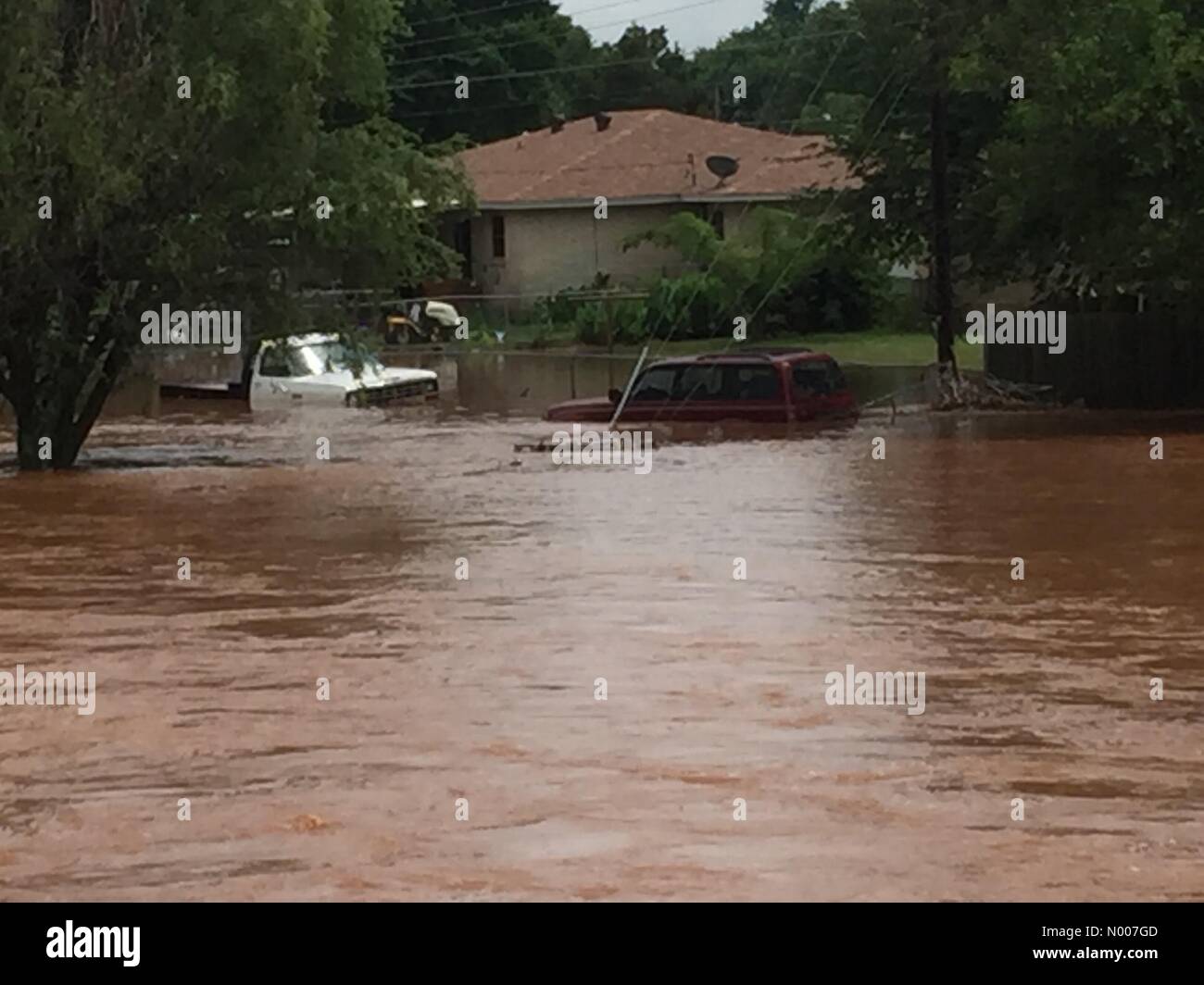 OK-19, Maysville, Oklahoma, USA. 12th June, 2016. Cars and homes submerged after Flashfloods drop 10 to 15 inches of rain the small Oklahoma town of Maysville. Credit:  Jazz Bishop/StockimoNews/Alamy Live News Stock Photo