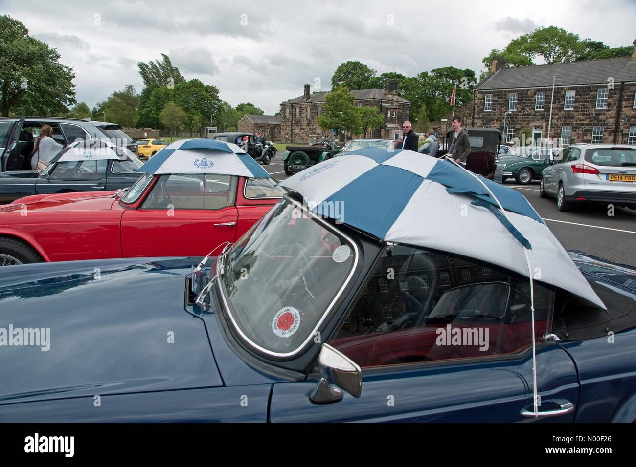 Preston, UK. 11th June, 2017. UK weather. Sports cars in the annual Manchester to Blackpool car rally put their top bonnets on in case of showers during a lunch stop at the Lancashire Infantry Museum in Fulwood Barracks, Preston Credit: Roger Goodwin/StockimoNews/Alamy Live News Stock Photo