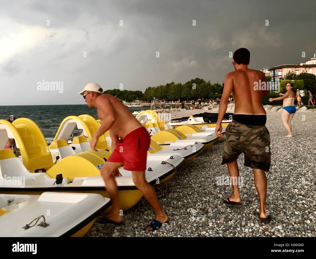 Italy thunderstorms- Bardolino, Lake Garda, Italy. Sunday 6th August - After a week of extreme hot weather thunderstorms arrive over Lake Garda at midday. Stock Photo