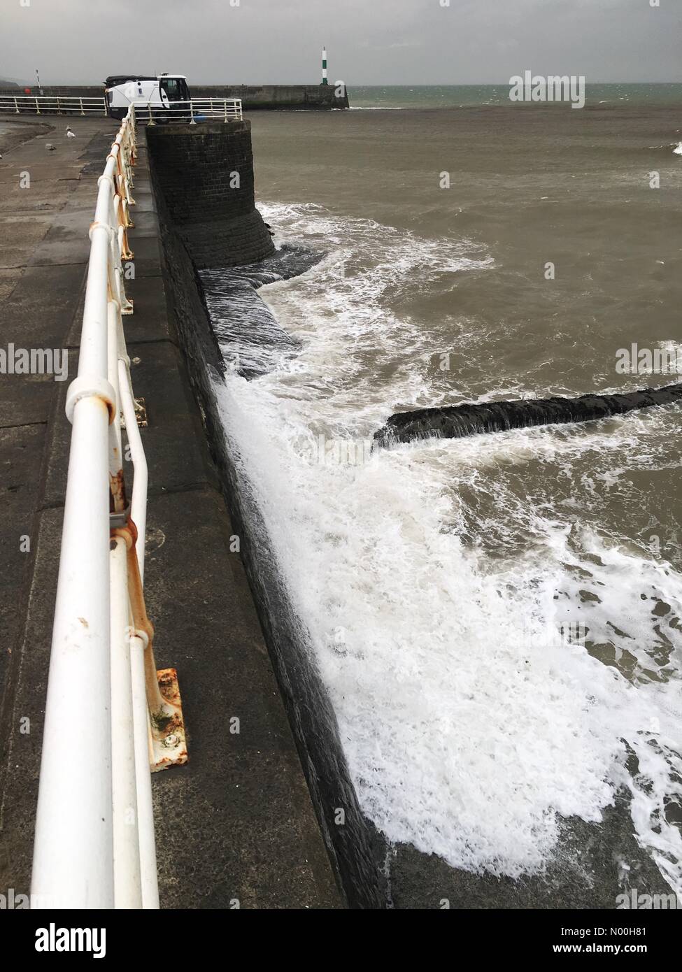 UK Weather- Storm Ophelia at Aberystwyth Wales - Strong winds blowing in from the South West across the Irish Sea begin to batter the harbour walls as Ophelia approaches. Stock Photo