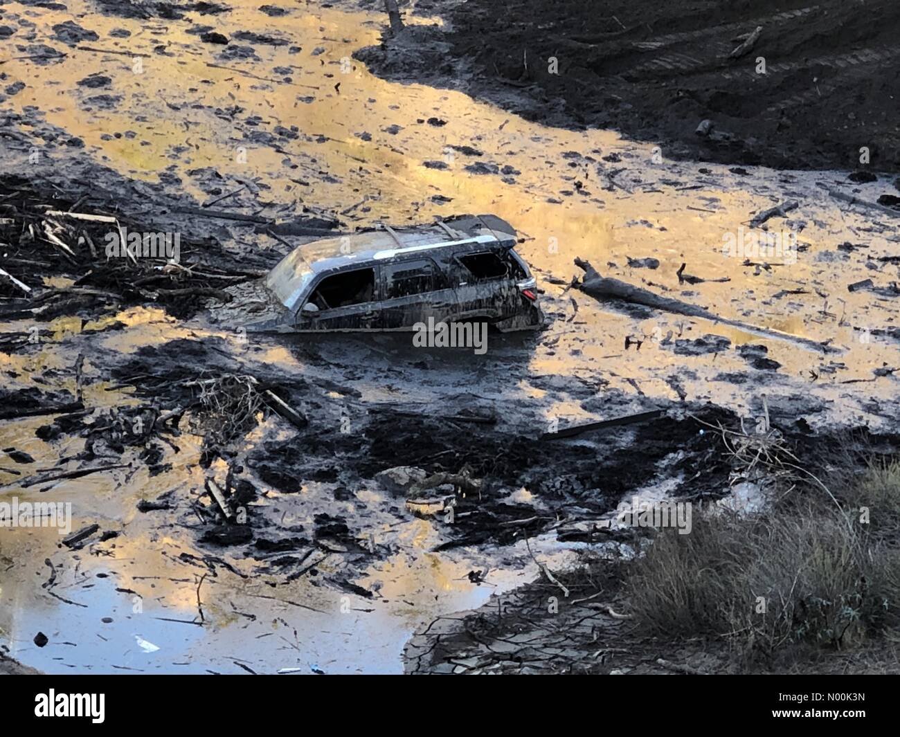 Burbank, California, USA. 24th Jan, 2018. SUV Found Stuck in Dam as a Result of Recent Mudslide in Burbank California. Credit: kathleen Piche/StockimoNews/Alamy Live News Stock Photo