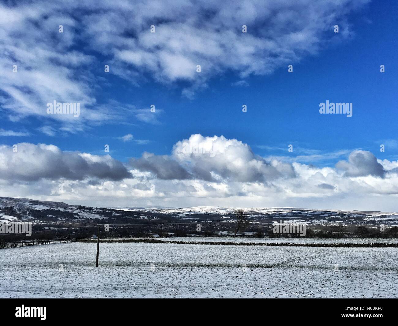 A mix of clear skies and snow Otley West Yorkshire UK Weather Stock Photo