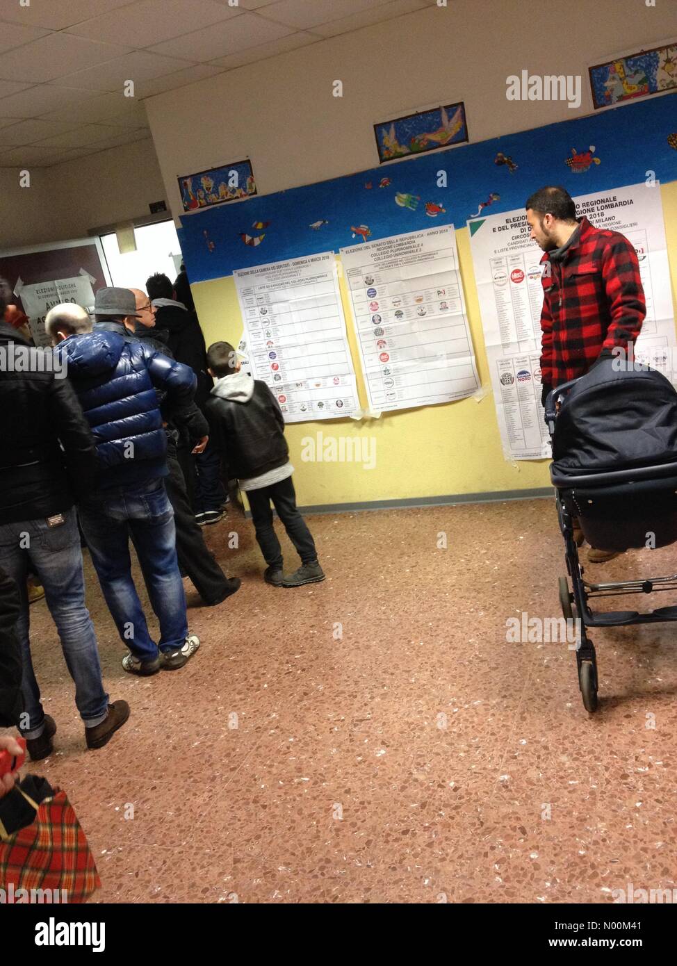 Italian national elections. Some people waiting for voting in Milan Stock Photo