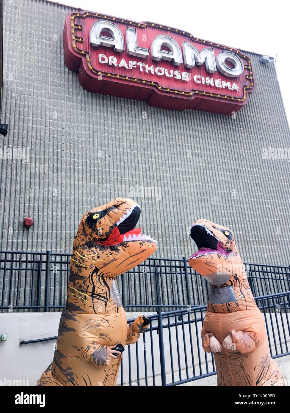 Yonkers, New York, USA. 23rd June, 2018. Yonkers NY - 23 July 2018: Dinosaurs outside the Alamo Drafthouse Cinema for the opening weekend of Jurassic World: Fallen Kingdom. Credit: Marianne A. Campolongo/StockimoNews/Alamy Live News Stock Photo
