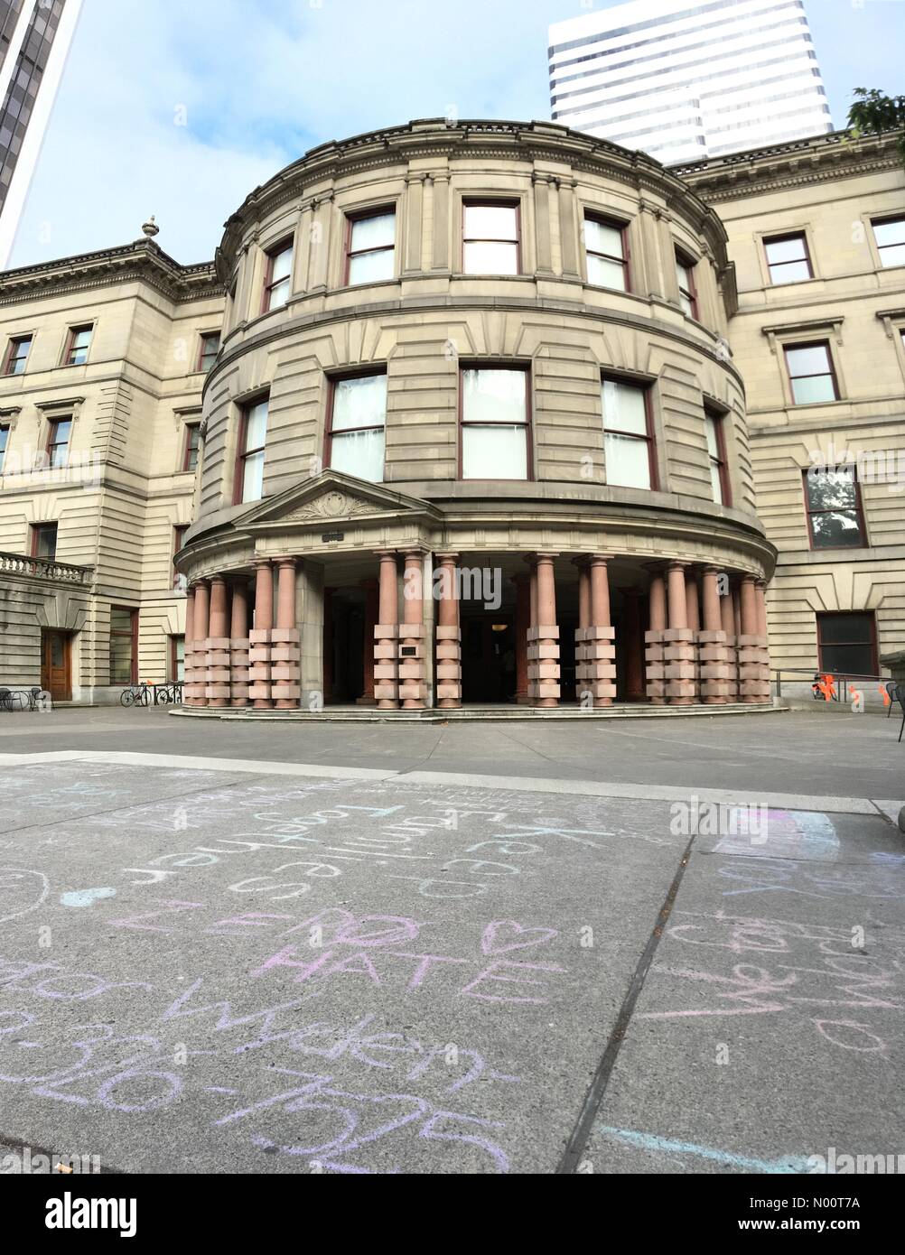 Portland, Oregon, USA. 10th July, 2018. Protest messages about the ICE office and the family separation policy in chalk on the sidewalk in front of Portland City Hall Credit: David Krug/StockimoNews/Alamy Live News Stock Photo