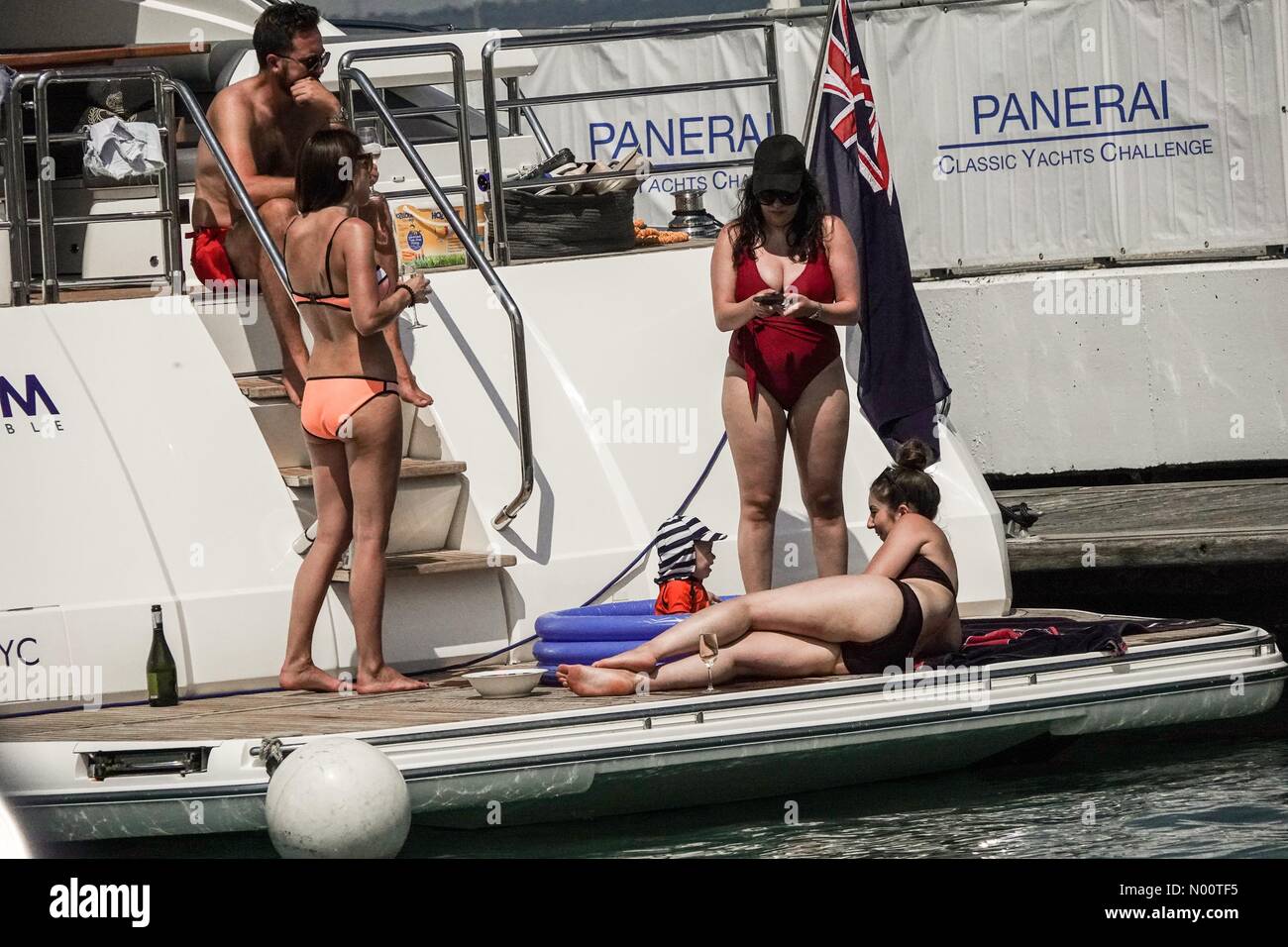 Cowes, UK, 14 July 2018. UK Weather: Sunny in Cowes. Yacht Haven Marina, West Cowes. 14th July 2018. Hot and sunny weather on the Isle of Wight today. Relaxing in style in West Cowes. Credit: jamesjagger/StockimoNews/Alamy Live News Stock Photo