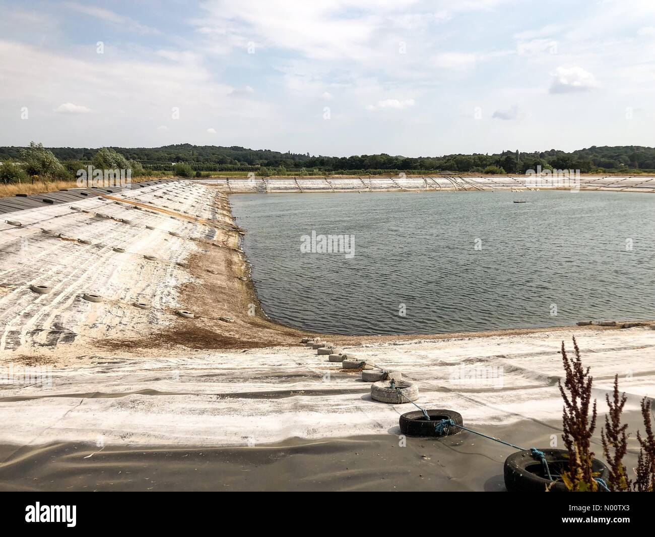 UK Weather: Water shortages in Godalming. Tuesley Lane, Godalming. 24th July 2018. Heatwave conditions in the south east today. Water levels at dangerously low levels in Godalming, Surrey. Credit: jamesjagger/StockimoNews/Alamy Live News Stock Photo