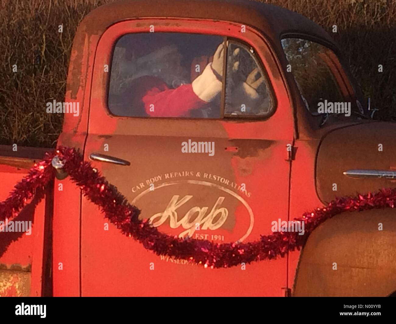 Steeple Claydon, Buckinghamshire, UK. 24th Dec 2018. Father Christmas &quot;Driving Home for Christmas!&quot; - roadside decoration Credit: PennPix/Matt Pennington/StockimoNews/Alamy Live News Stock Photo