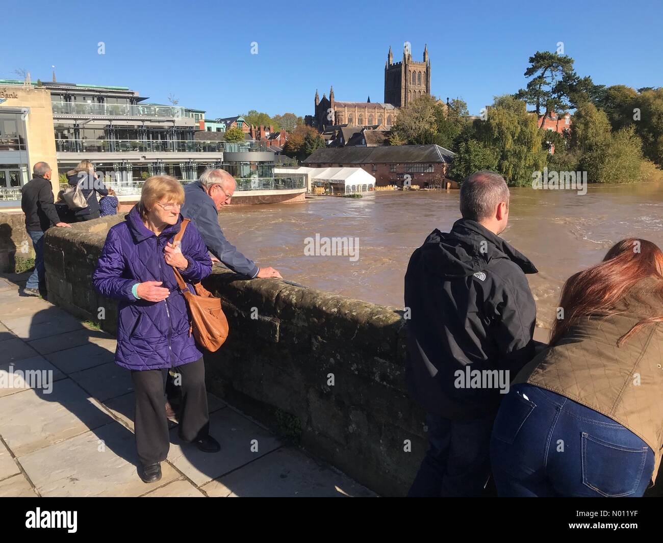 Hereford, UK. 27th Oct, 2019. UK Weather Flooding at Hereford UK - Crowds father to watch as the the River Wye is extremely high at Hereford with some flooding on the left bank including the De Koffie Pot pub. Credit: Steven May / StockimoNews/Alamy Live News Stock Photo