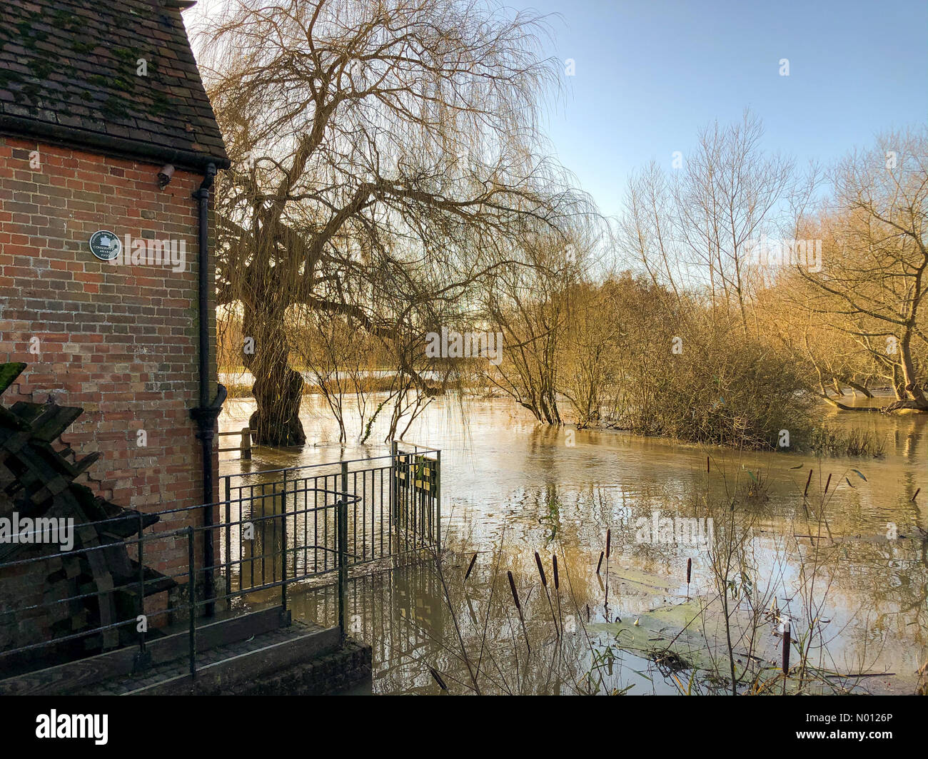 Cobham, Surrey. 23rd Dec 2019. UK Weather: Flooding in Cobham. A245, Cobham. 23rd December 2019. Flood warnings in place for the Home Counties today. The River Mole burst its banks in Cobham in Surrey. Credit: jamesjagger/StockimoNews/Alamy Live News Stock Photo