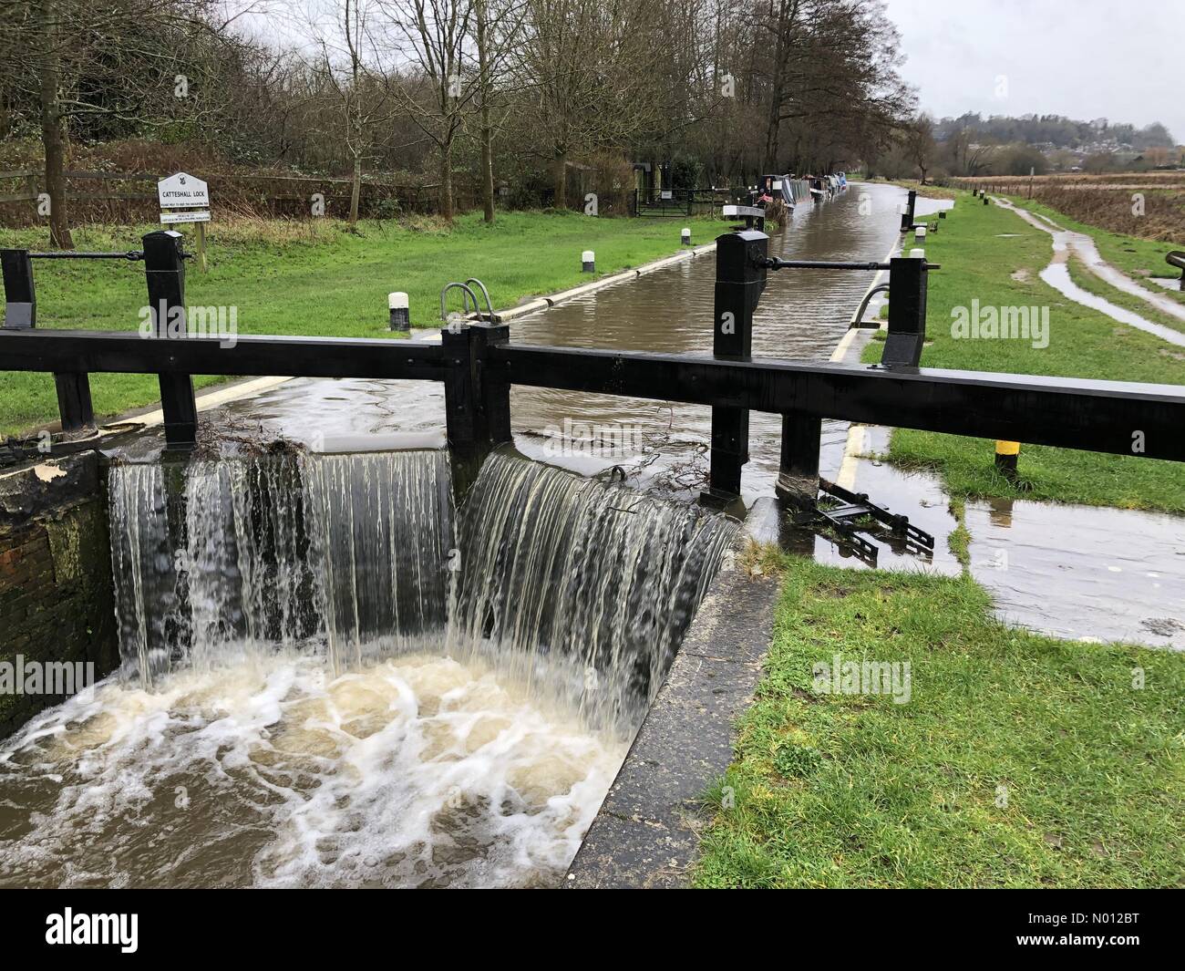 UK Weather: Flooding in Godalming. Catteshall Lane, Godalming. 16th February 2020. Heavy rainfall from Storm Dennis overnight. Catteshall Lock overtopping on the River Wey in Godalming in Surrey. Credit: jamesjagger/StockimoNews/Alamy Live News Stock Photo