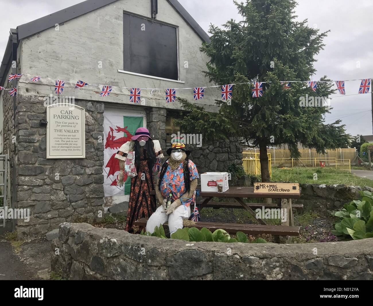 Bishopston, Wales, UK. 10th May, 2020. Scarecrow “Covid19” display outside the Valley Public House in the Bishopston district of Swansea this afternoon. Credit: Phil Rees/StockimoNews/Alamy Live News Stock Photo