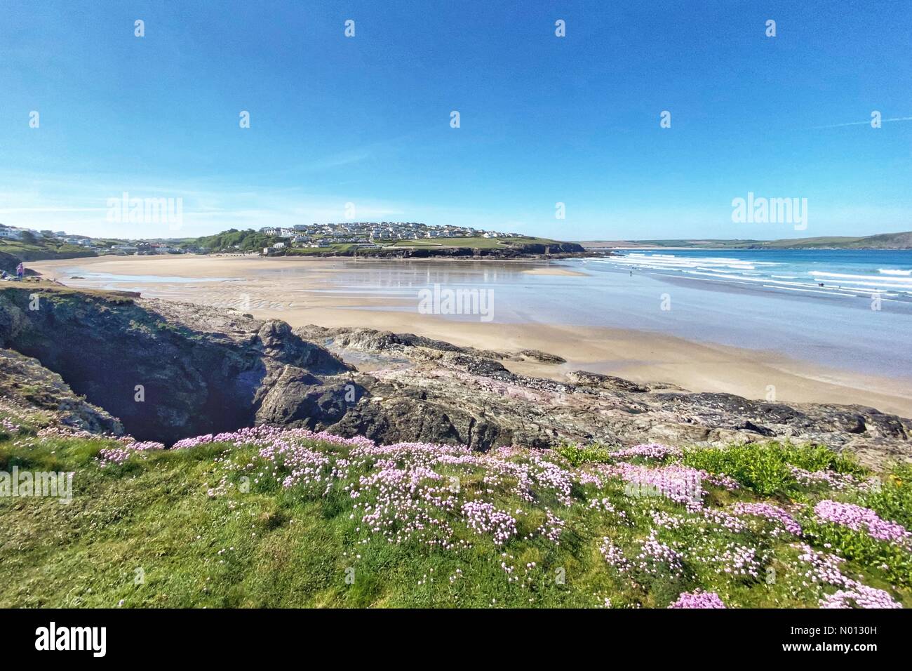 Polzeath beach, Cornwall. 20th May 2020. UK Weather: Overlooking an almost deserted Polzeath beach, Cornwall Credit: nidpor/StockimoNews/Alamy Live News Stock Photo