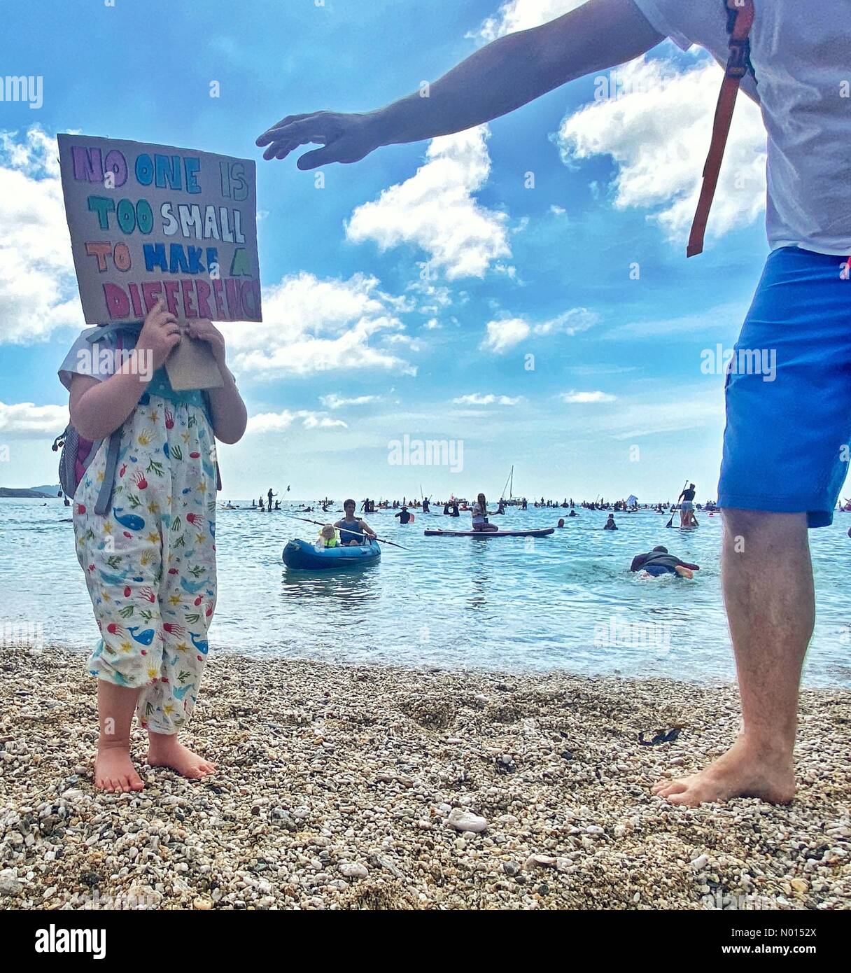 Gylly beach, Falmouth, Cornwall, UK. 12th June, 2021. G7 Paddle out protest at Falmouth, Cornwall, UK. Credit: nidpor/Alamy live news Credit: nidpor/StockimoNews/Alamy Live News Stock Photo