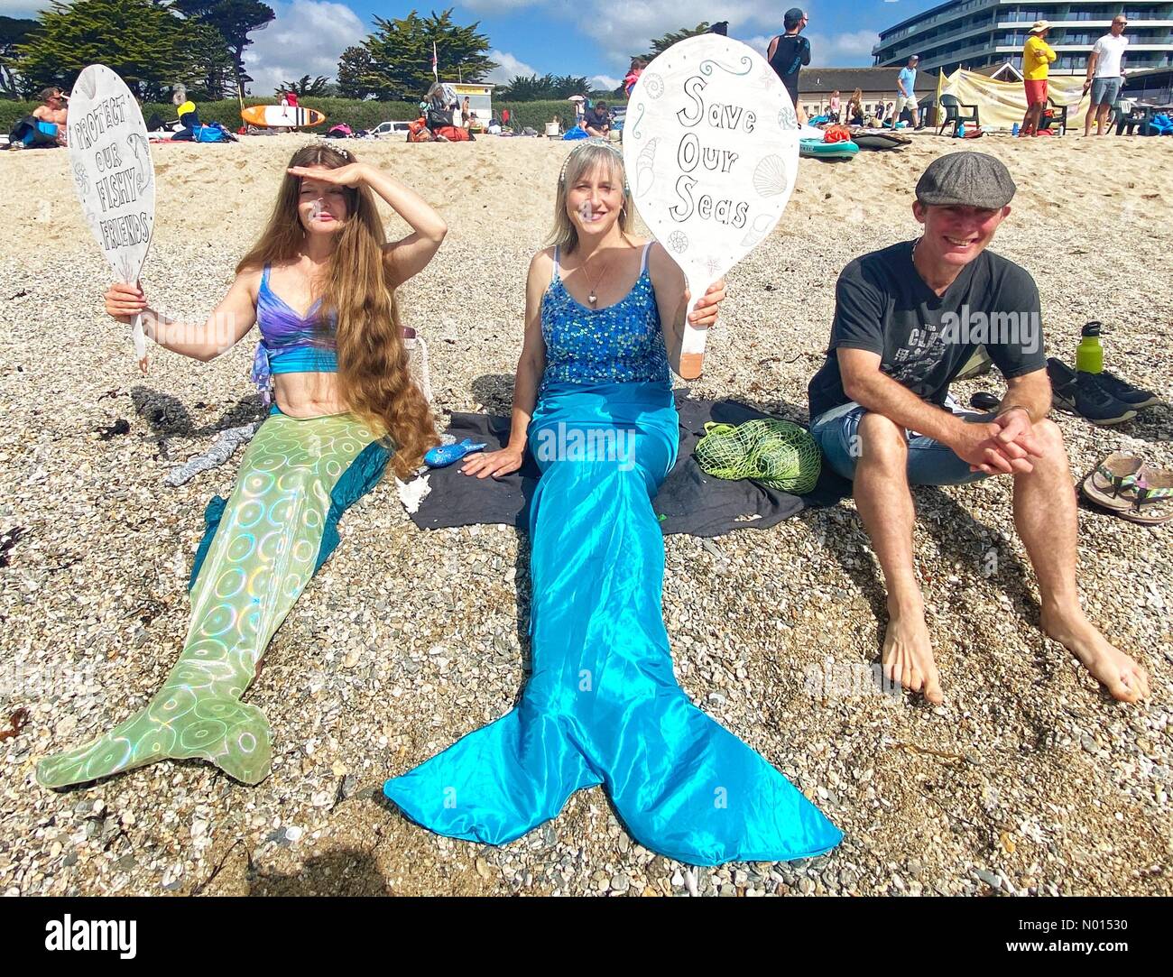 Gylly beach, Falmouth, Cornwall, UK. 12th June, 2021. G7 Paddle out protest at Falmouth, Cornwall, UK. Credit: nidpor/Alamy live news Credit: nidpor/StockimoNews/Alamy Live News Stock Photo