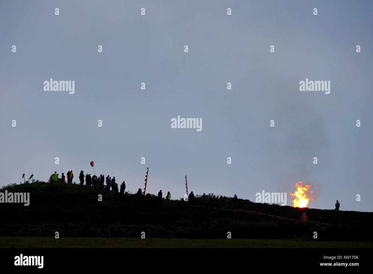 St Agnes, Cornwall, UK. 30th April 2022. Community light the beacon high above the town during annual Bolster festival at St Agnes in Cornwall, UK. 30th April, 2022. Credit nidpor/ Alamy Live News Stock Photo