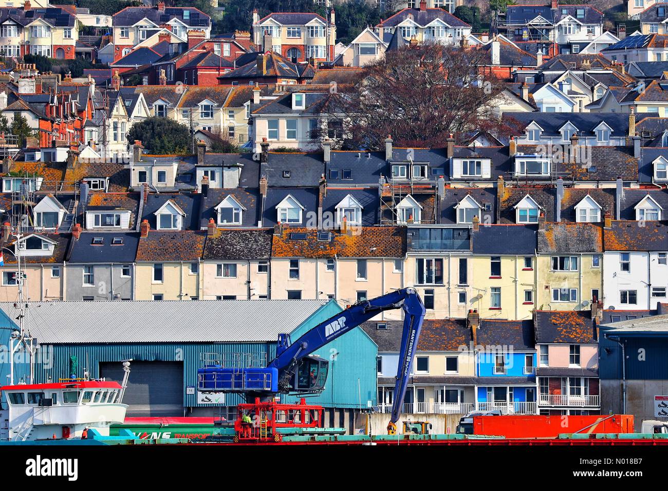 UK Weather Sun lights terraces of Teignmouth town. Devon, UK. 21 April