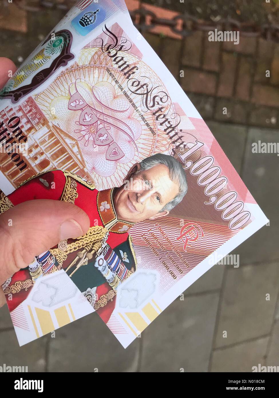 King Charles anti monarchy banknote- Cardiff Wales - Saturday 6th May 2023 - Fake King Charles III £1,000,000 one million pound banknote Bank of Eternity handed out by republican supporters. Stock Photo