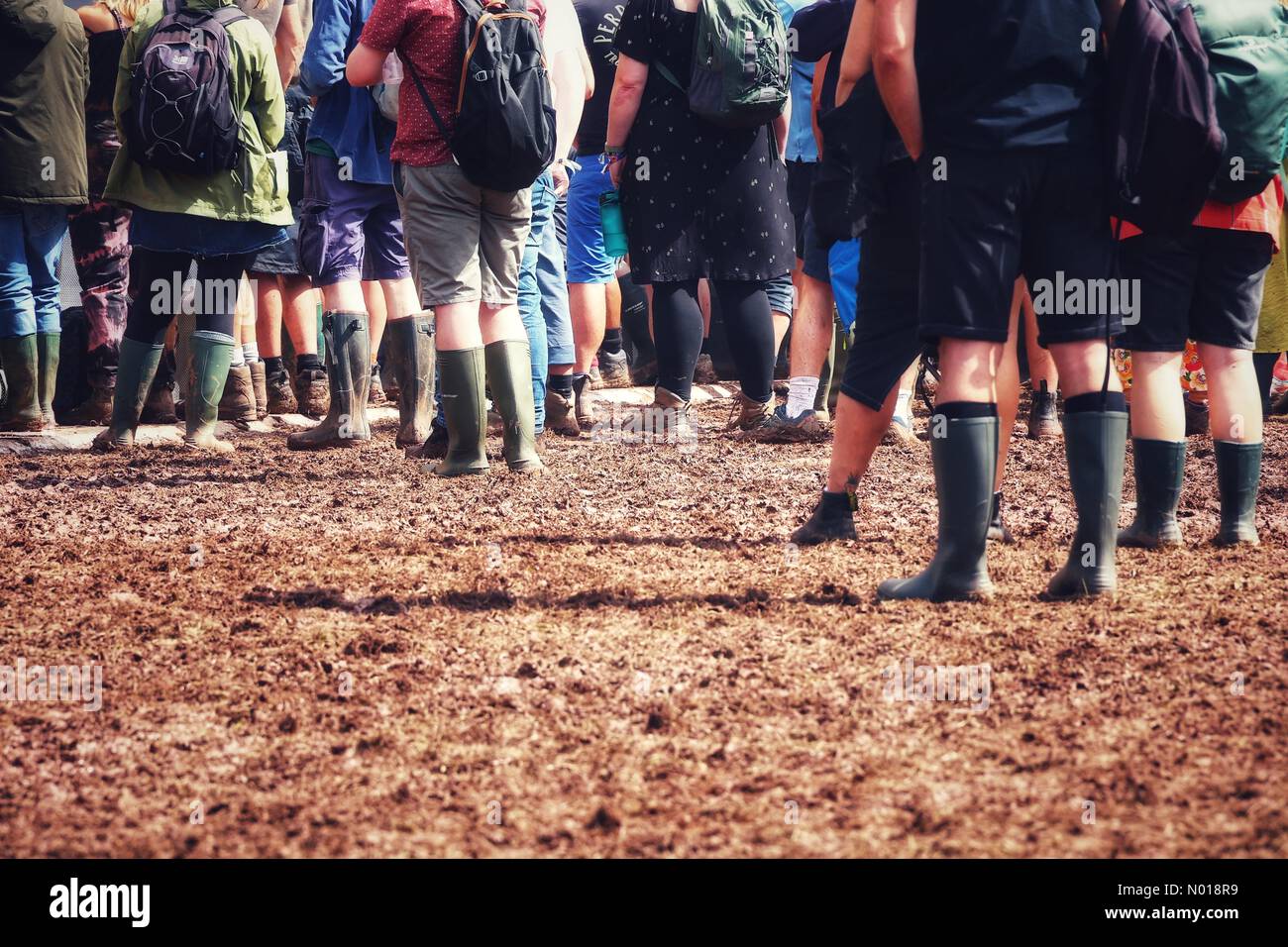 Green Man festival, Brecon Beacons, Wales, UK. 19th August, 2023. Boots de rigeur as wellied crowds enjoy mud at Green Man festival 2023. Credit: nidpor/Empics/Alamy Live News Stock Photo