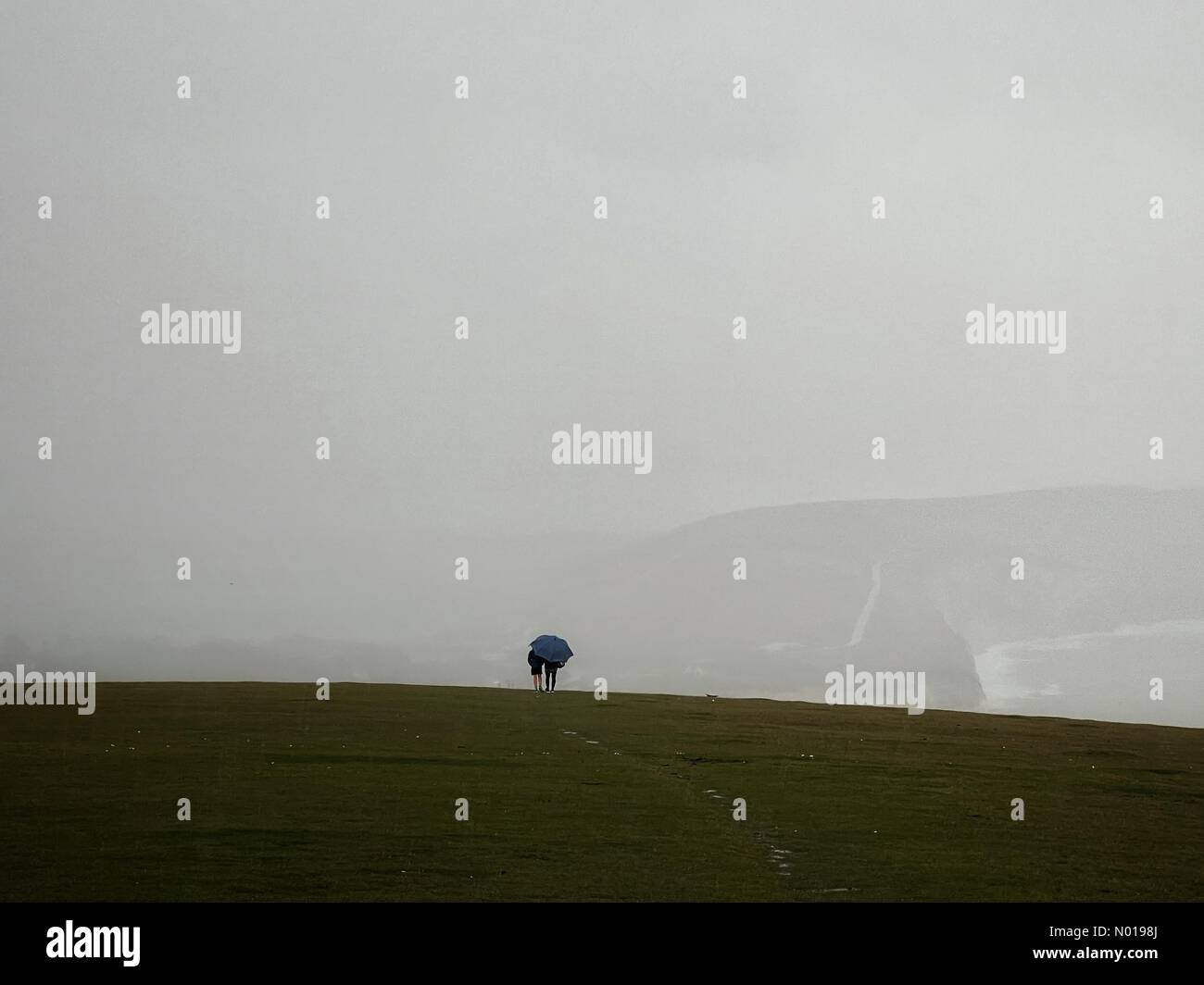 UK Weather: Hailstorm over the Isle of Wight. Tennyson Down, Freshwater. 27th October 2023. Heavy showers along the South Coast today. A hailstorm over Tennyson Down on the Isle of Wight. Credit: jamesjagger/StockimoNews/Alamy Live News Stock Photo