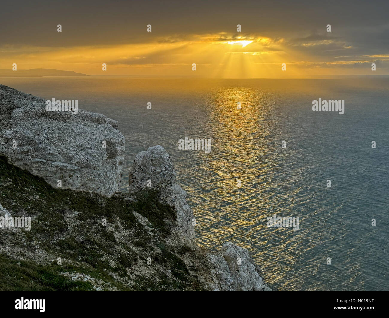 UK Weather Sunbeams over the Isle of Wight. Tennyson Down, Totland