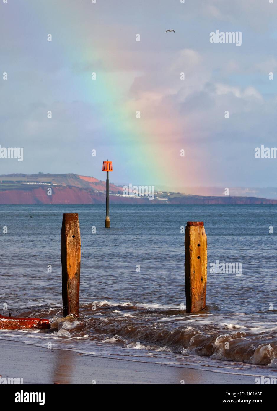 UK Weather Rainbow at Teignmouth beach, Devon, UK. 5 Jan, 2024. Credit