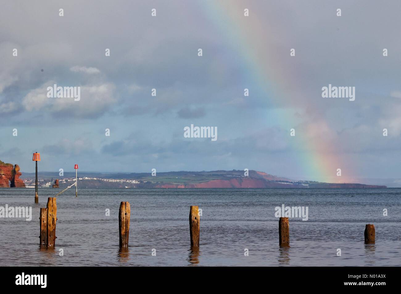 UK Weather Rainbow at Teignmouth beach, Devon, UK. 5 Jan, 2024. Credit