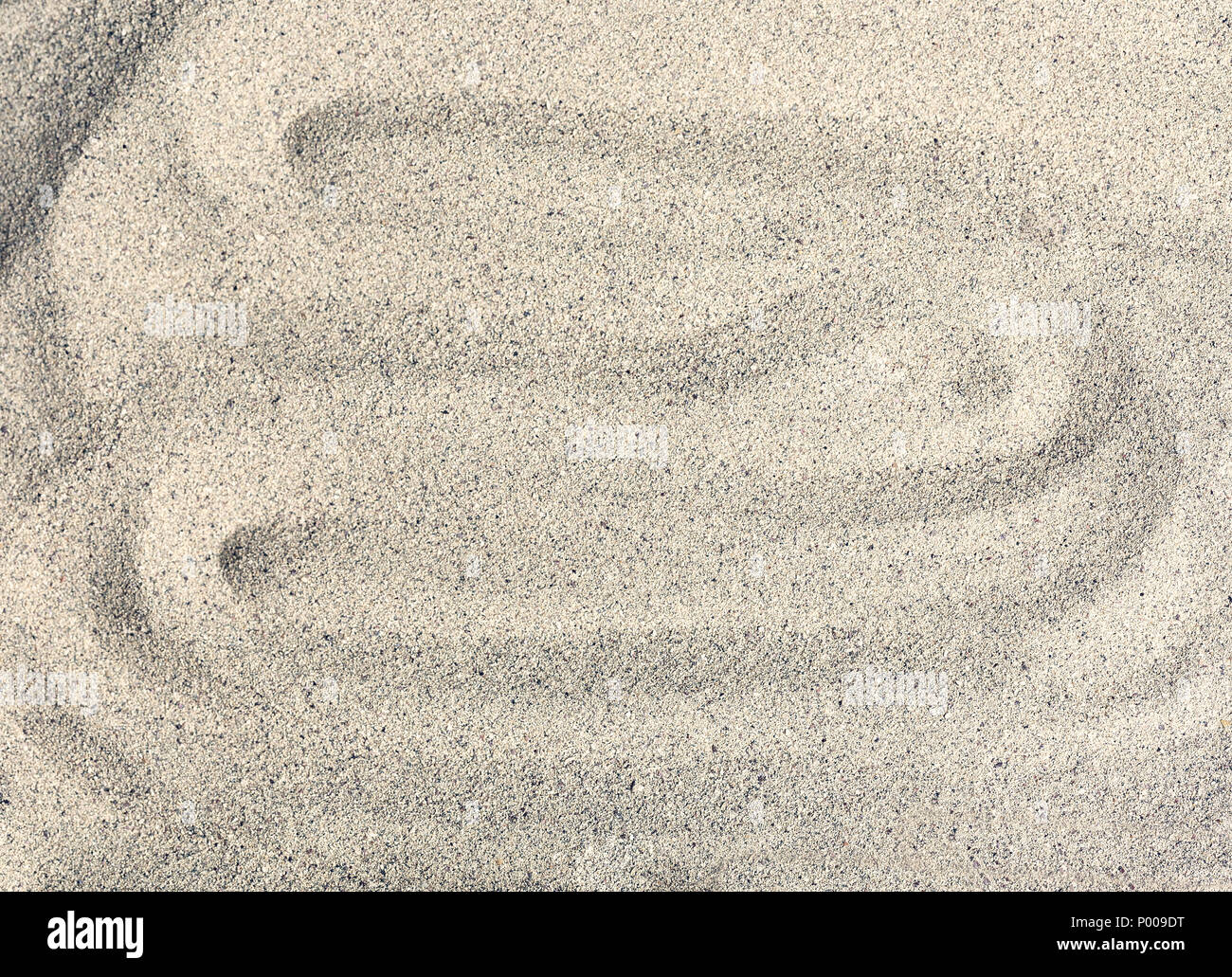 Sea sand, wavy background. Fine granules. Stock Photo