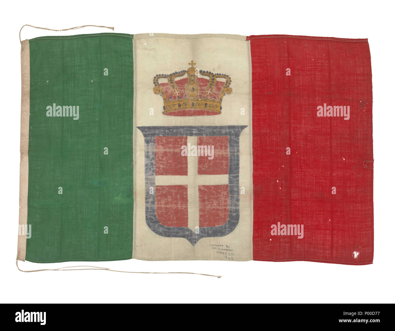 .  English: Italian naval ensign (before 1946) A pre-1946 pattern Italian naval ensign, inscribed in ink: 'CAPTURED BY H.M. SUBMARINE UNSEEN 1942'. The ensign is made of wool bunting with a cotton hoist containing a cord and is machine sewn. The flag has three vertical stripes in green, white and red. On the centre stripe the arms of Savoy are painted — a blue-bordered red shield with a white cross overall and a crown above. The donor's husband Eric William Watts served in HMS 'Unseen'. She was not commissioned until 1943 when she was attached to the 10th submarine flotilla, Malta. During 1943 Stock Photo